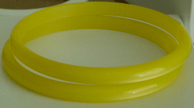 Lucite iridescent yellow bangles