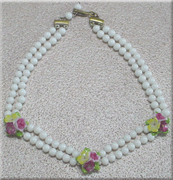 Two strand white glass bead necklace with porcelain flowers