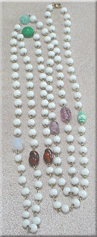White glass bead necklace with colored accent beads