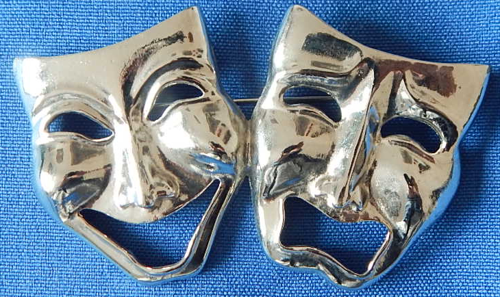 Silver masks pin